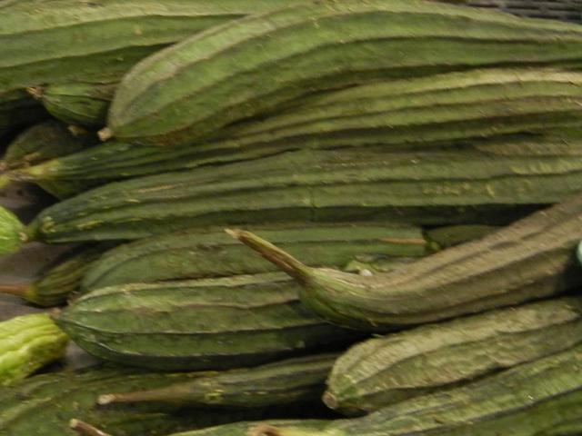 Photo of Chinese Okra, a long, green, ribbed, cucumber-shapped vegetable