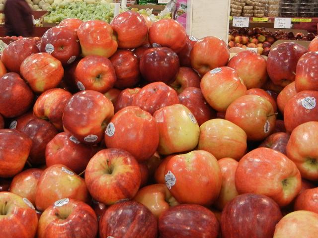 Gala apples, large, red and yellowish with a slight stripey pattern