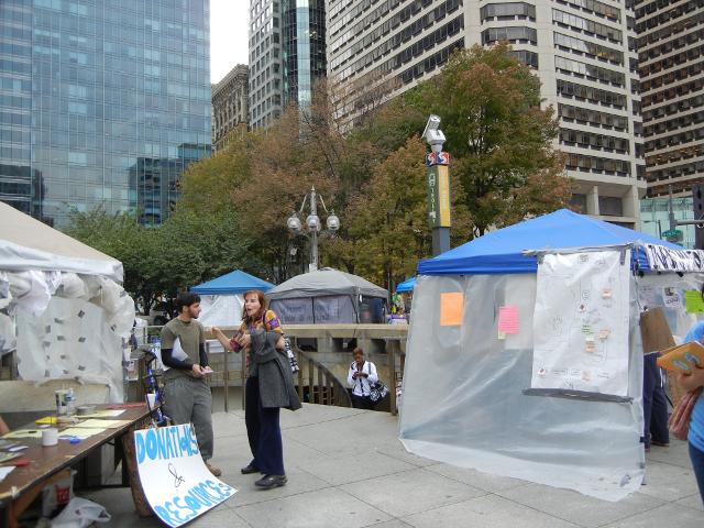 The entrance to the SEPTA station at city hall, Philadelphia, surrounded by tents and people of the Occupy Philly protest