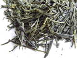 Closeup of loose-leaf sencha, a green tea with straight, thin leaves