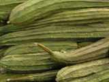 Photo of Chinese Okra, a long, green, ribbed, cucumber-shapped vegetable