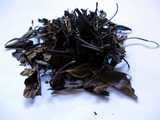 Coarse, large, but delicate-looking, dark brown tea leaves