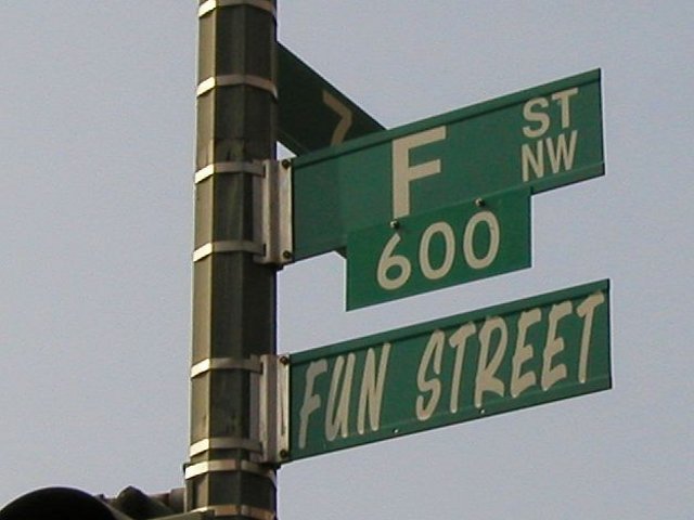 Street sign pole with sign reading F ST NW, 600, and a sign labelled FUN STREET below
