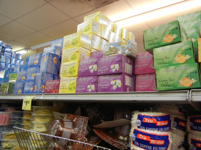 A bunch of boxes of teabags of Lindsay Gardens Tea on a shelf
