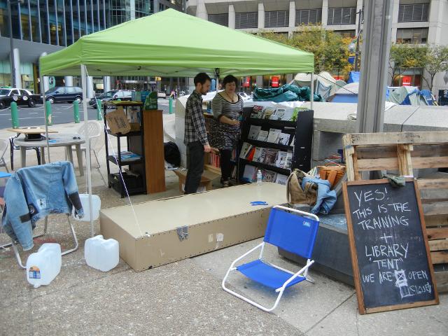 Training and library tent at Occupy Philly, a light green tent with lots of books