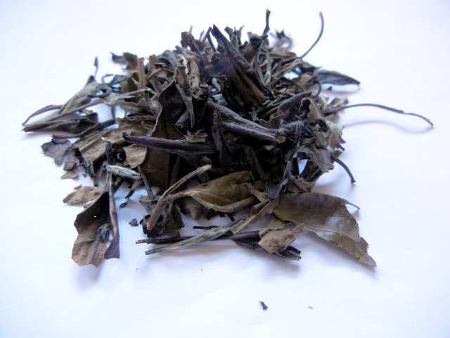 Coarse, large, but delicate-looking, dark brown tea leaves