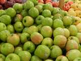 Granny smith apples, bright yellowish green with some pink on them