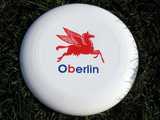White frisbee with a logo resembling Mobil pegasus, but with a cow's udder, and the name Oberlin written in the style of the logo
