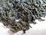 Closeup of green tea, showing twisted leaves with rich green color