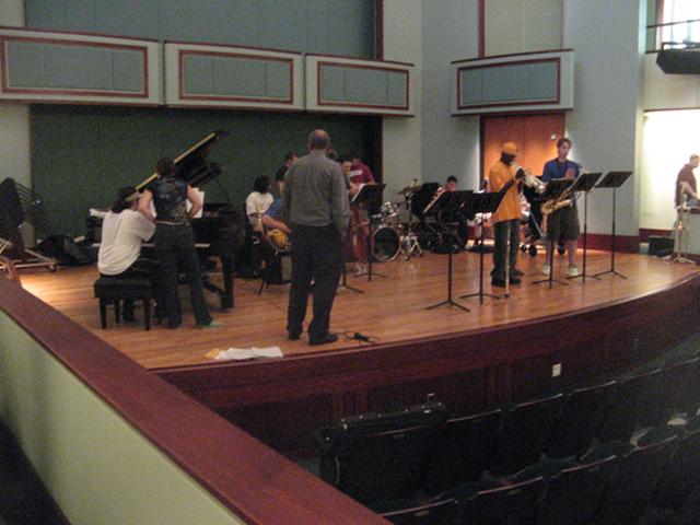 A jazz ensemble on stage, practicing